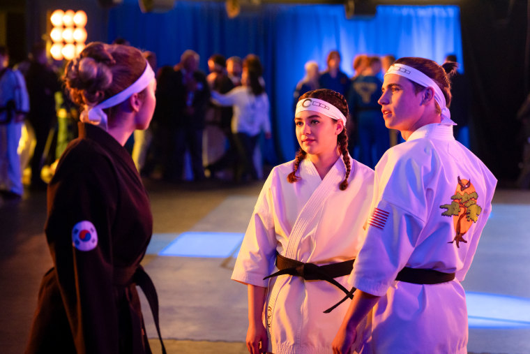 Mary Mouser, Center and Tanner Buchanan Wear Karate -Uniforms