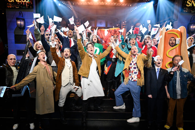 Pictured: (l-r) Paul Shaffer, Scarlett Johansson, Alex Moffat, Taran Killam, Jason Segel, Lin-Manuel Miranda, Colin David Jones, Devon Walker, Ana Gasteyer, John Mulaney, Kristen Wiig, Kenan Thompson, Maya Rudolph, Pete Davidson, Will Forte, Nathan Lane, Sarah Sherman, Adam Driver, David Spade and Cecily Strong during the "New York 50th Musical" sketch