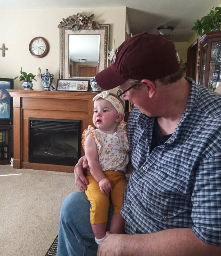 Jason Kilburn with his daughter, Caroline, who is listed in state records as Unakite Thirteen Hotel.