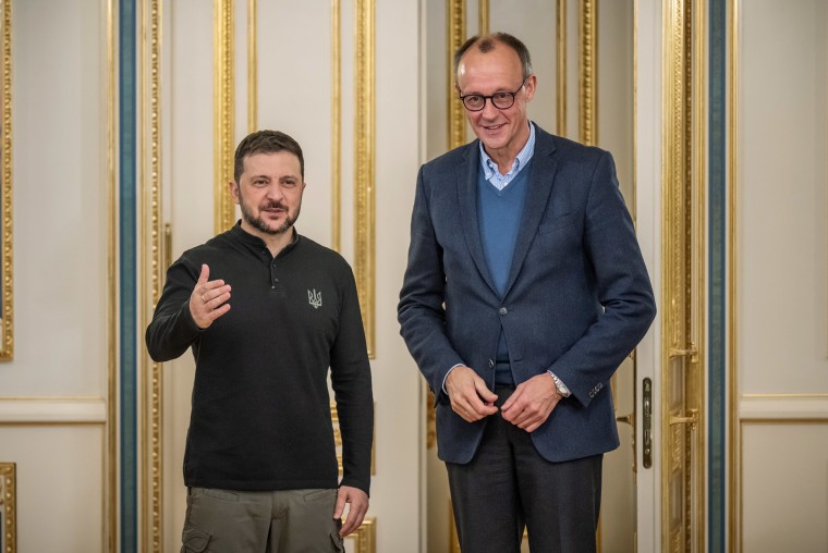 Friedrich Merz, then-chairman of Germany's CDU party, stands next to Ukrainian President Volodymyr Zelenskyy