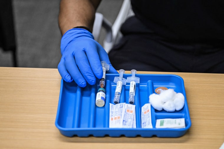 A health worker prepares a dose of the measles vaccine at a health center in Lubbock, Texas, on Feb. 27, 2025.