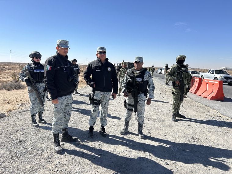 Mexican National Guard Major Alexander Vasquez Hernandez, in the center, with his troops and Mexican Army soldiers patrolling the Santa Teresa crossing into the U.S.