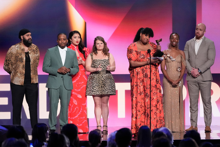 Arkie Kandola, from left, Chris Powell, Jaylee Hamidi, Michelle McLeod, Natasha Rothwell, Elle Lorraine and KeiLyn Durrel Jones accept the award for best ensemble cast in a new scripted series for "How to Die Alone" during the Film Independent Spirit Awards on Saturday.