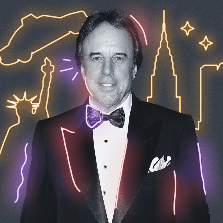 Kevin Nealon with yellow neon signs behind them on a gray background