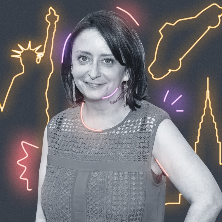 Rachel Dratch with yellow neon signs behind them on a gray background