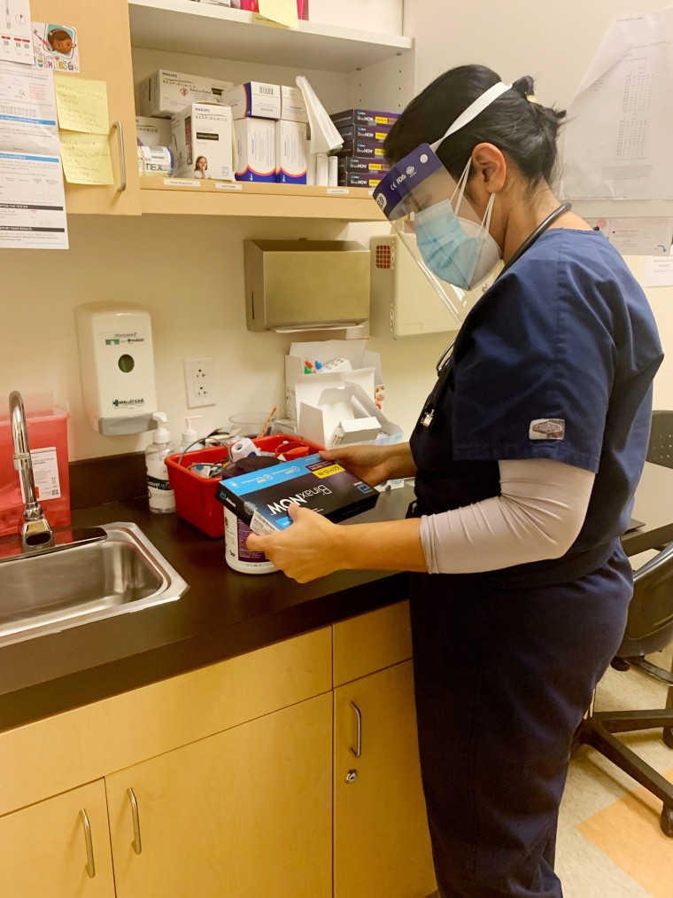 Dr. Kavita Patel prepares to hand out covid tests in her community.