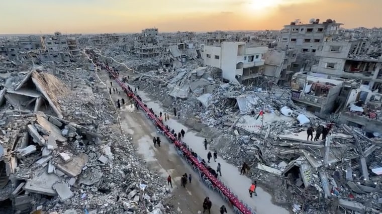 Palestinians in Rafah sit down for iftar, or breakfast, after the first day of the fast on Saturday evening.