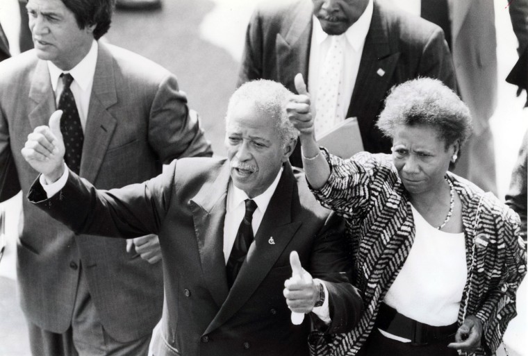 David Dinkins, center, and Hazel N. Dukes, right, give "thumbs ups" outside