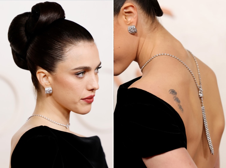 Margaret Qualley is a vision in a black backless dress.