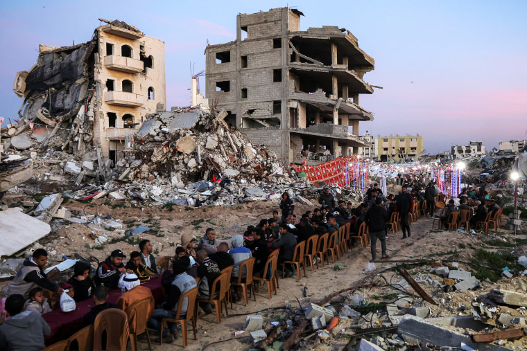 People gather for a communal iftar fast-breaking mealin Gaza City