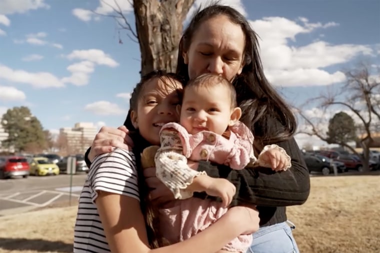 Maria and her two daughters, Nicolle and Jade, embrace outside their immigration lawyer’s office in Denver.