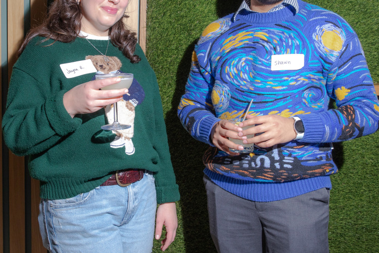 Jayna Rubin and Shawn Jose savor their drinks while mingling.