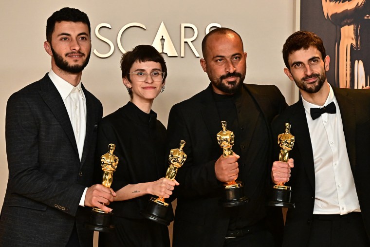 Israeli journalist and filmmaker Yuval Abraham, Palestinian journalist and filmmaker Basel Adra accept the award for Best Documentary Feature for "No Other Land" 