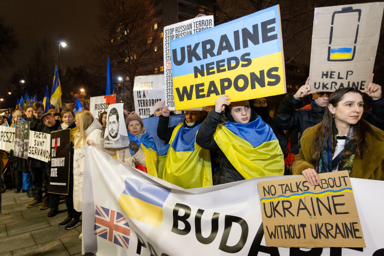 Pro-Ukraine protesters outside the U.S. embassy in Warsaw