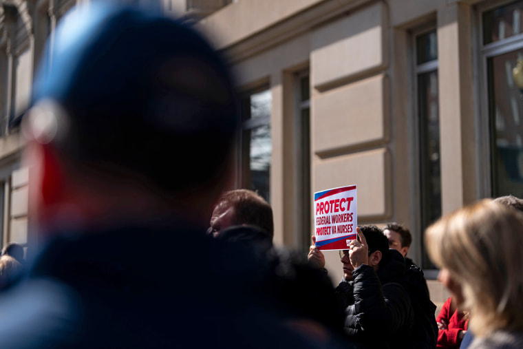 Demonstrators outside the Department of Veterans Affairs headquarters in Washington on Feb. 13, 2025.