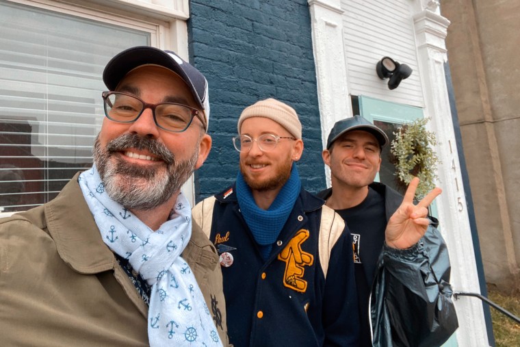 Mickey Harmon, center, with Brian Bartlett, right, and Derrick Van Grol, left, visiting Pittsburgh, Pennsylvania, for a dance party in 2022.