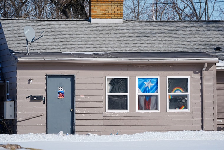 Puerto Rico and Rainbow flags hang in commemoration of Sam Nordquist at Patty's lodge 