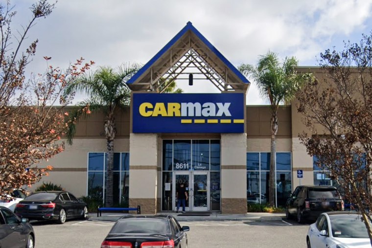 The exterior of a CarMax dealership storefront