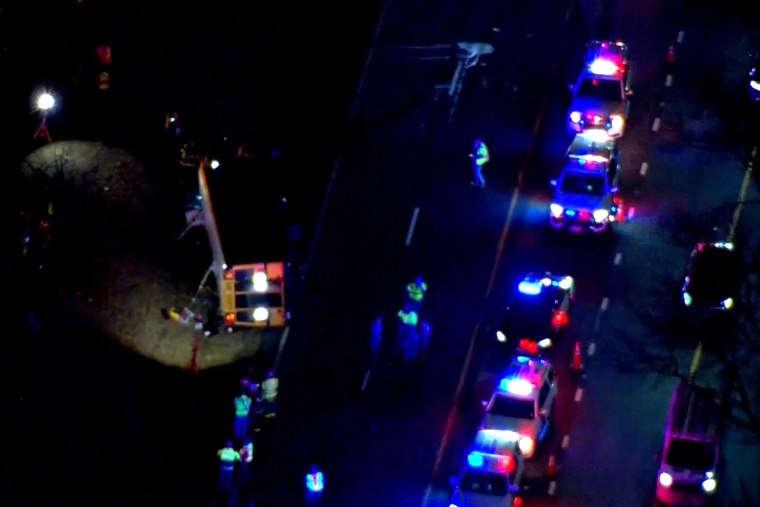 traffic overturned school bus aerial nighttime night