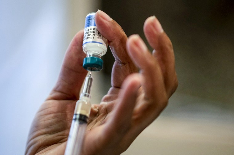 A nurse prepares measles, mumps and rubella.