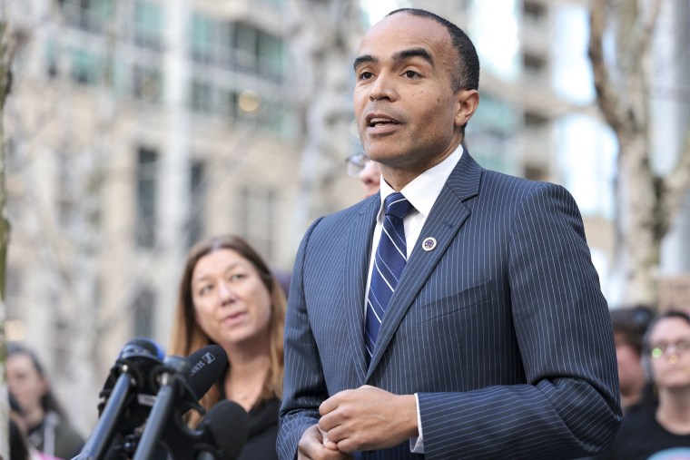 Washington State Attorney General Nick Brown speaks outside court in Seattle on Feb. 28, 2025.