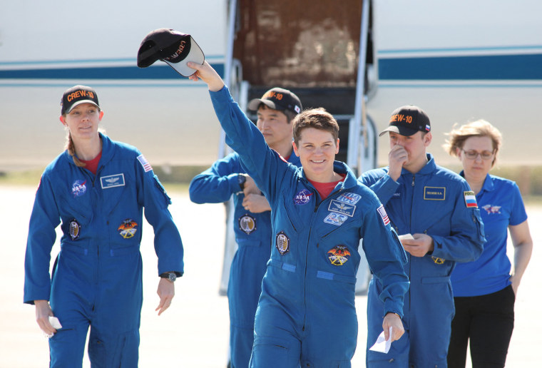 SpaceX Crew-10 commander Anne McClain waves alongside crewmates 