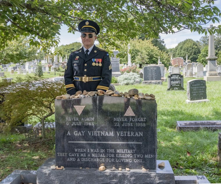 A veteran visits the grave of Leonard Matlovich in the Congressional Cemetery, in Washington D.C., on the 10th anniversary of "Don't Ask, Don't Tell", in 2021. 