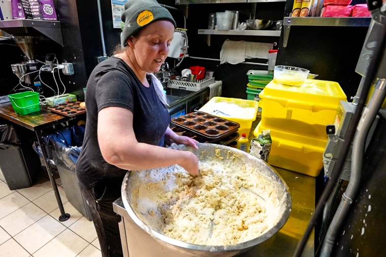 Mary O'Halloran mixes her next batch of soda bread batter for customers waiting in the store