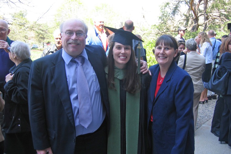 The author poses with her parents at her 2007 medical school graduation.