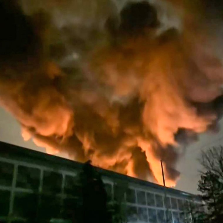 Smoke billows from a fire at a neighborhood electrical substation supplying power to Heathrow Airport in Hayes, west London on March 21, 2025. 