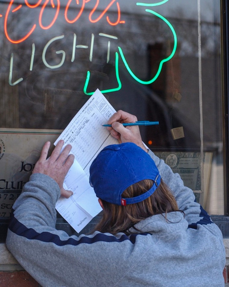 A person fills out a bracket.