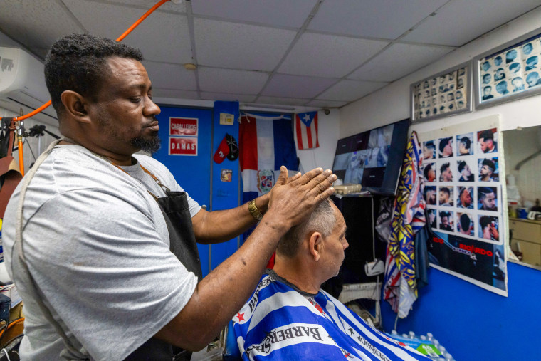 A person cuts air in a barbershop.