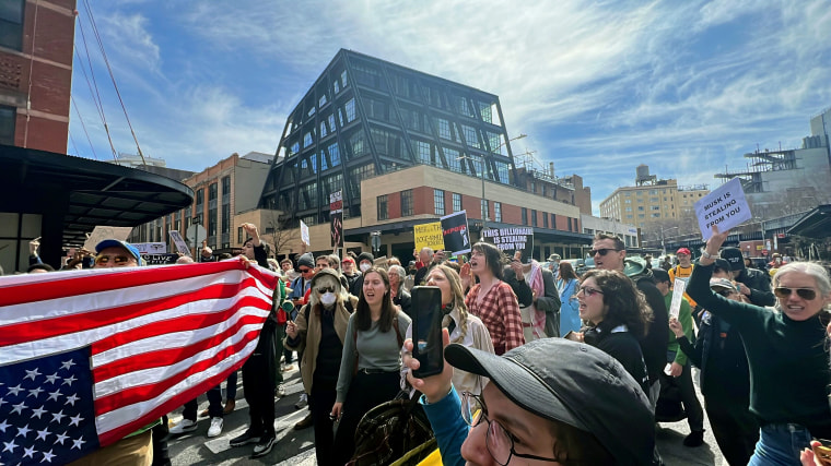 Protesters gather outside Tesla