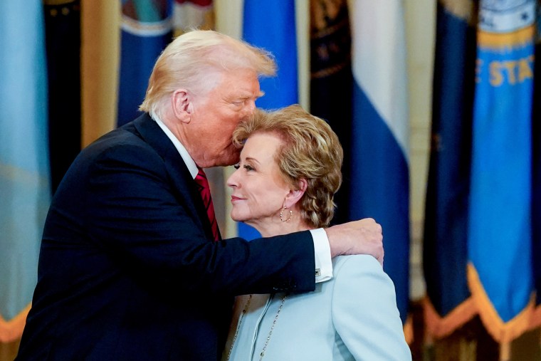 President Donald Trump speaks with Linda McMahon