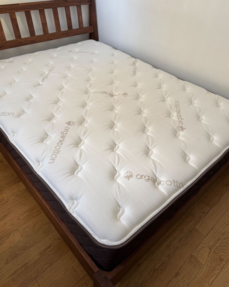 Engineered Sleep mattress without a cover on it on a bed frame.