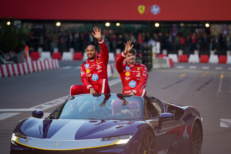 Charles Leclerc and Lewis Hamilton at a Ferrari race street show on March 6, 2025 in Milan.