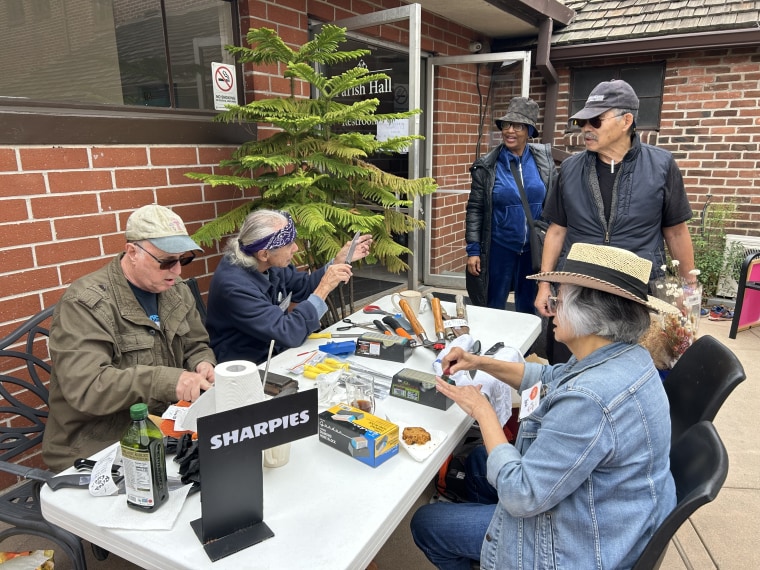 A knife-sharpening volunteer table at a Repair Cafe Pasadena event in March 2025.