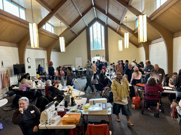 Volunteers fix computers, jewelry and clothes at a Repair Cafe Pasadena event in March 2025.