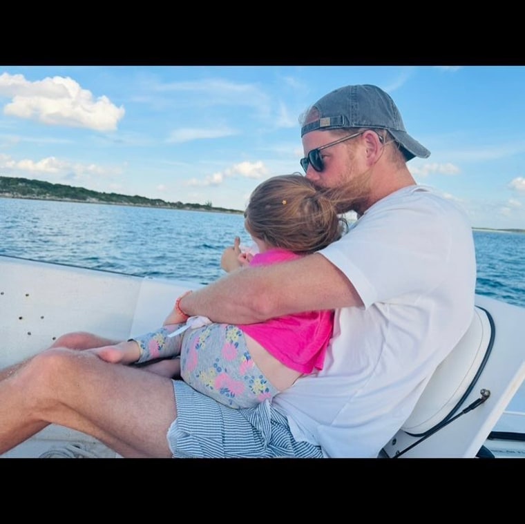 Prince Harry and his daughter on a boat together.