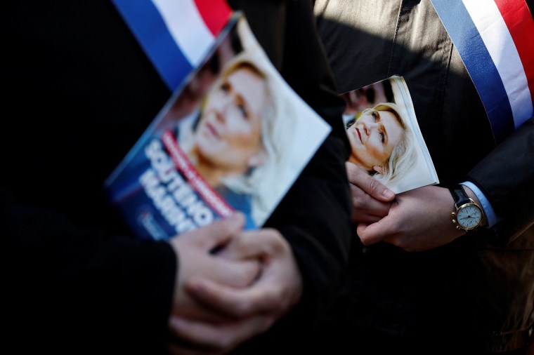 Members of the RN party distribute leaflets in support of Marine Le Pen in Henin-Beaumont