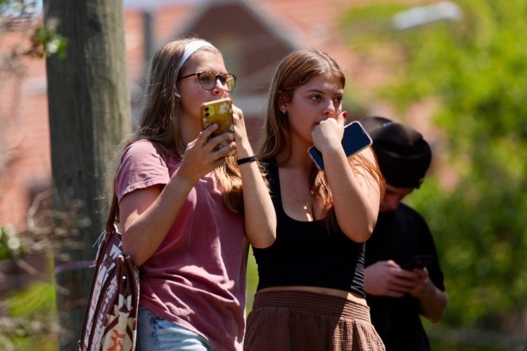 Evacuees watch law enforcement