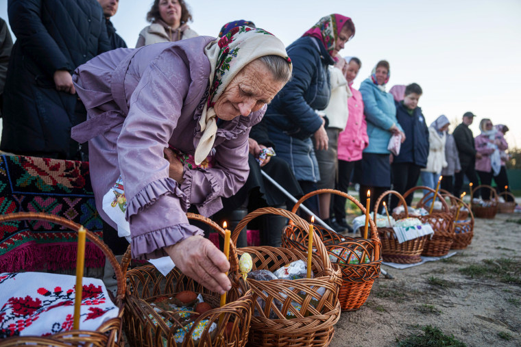 An elderly woman prepares her Easter baskets