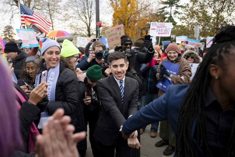 Chase Strangio, the first transgender attorney to argue before the Supreme Court, with supporters on Dec. 4, 2024, when the court heard the case of U.S. vs. Skrmetti.