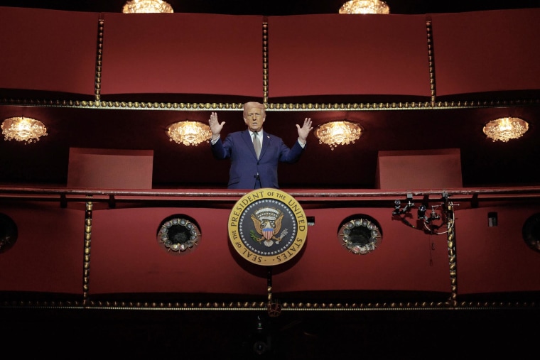 President Donald Trump looks down from the presidential box in the opera house in the John F. Kennedy Center for the performing arts 