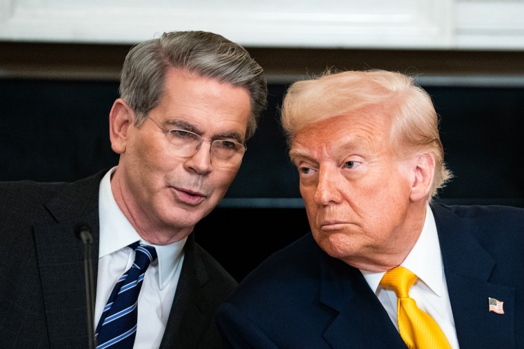 Scott Bessent, left, speaks with President Trump