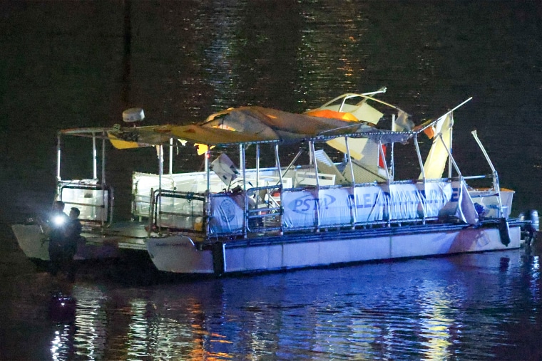 Investigators search the wreckage of a Clearwater Ferry after a boat crashed into the ferry causing multiple injuries near the Clearwater Memorial Causeway Bridge, on Sunday, April 27, 2025, in Clearwater, Fla.