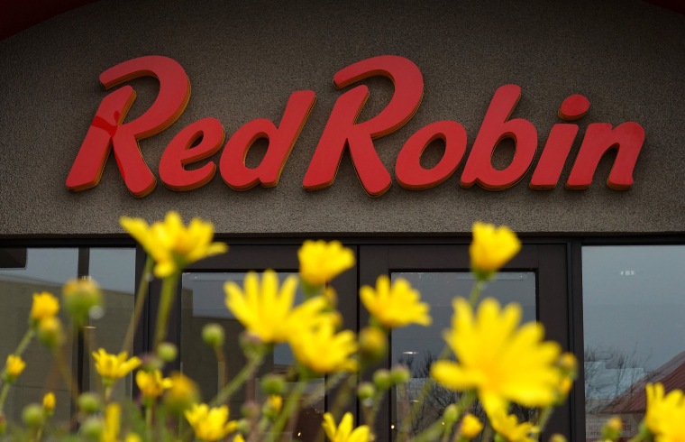 A sign is posted on the exterior of a Red Robin restaurant on December 18, 2024 in San Bruno, California.