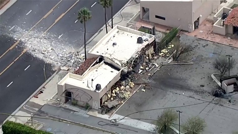 Debris is spilled onto the street after what the Mayor described as a bomb exploded in Palm Springs