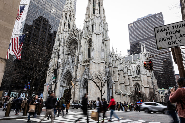 External view of St. Patrick's Cathedral, people go out on the street