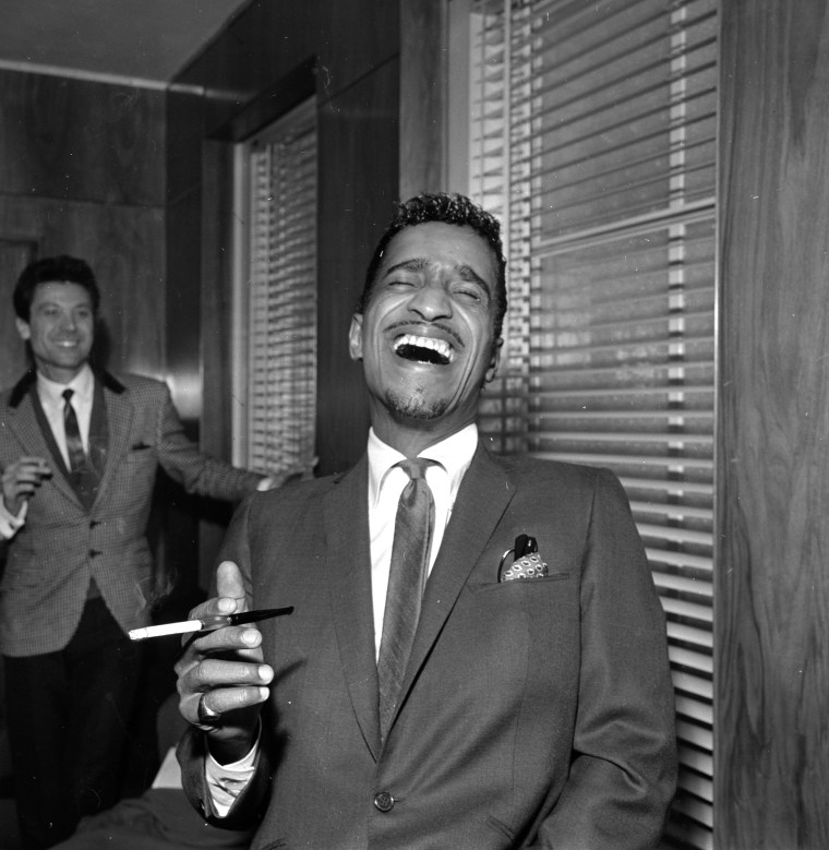 Sammy Davis Jr. showing clips of his film "Robin and His Hood Men" in 1964.